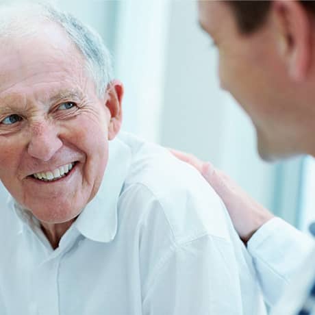 Doctor helping patient